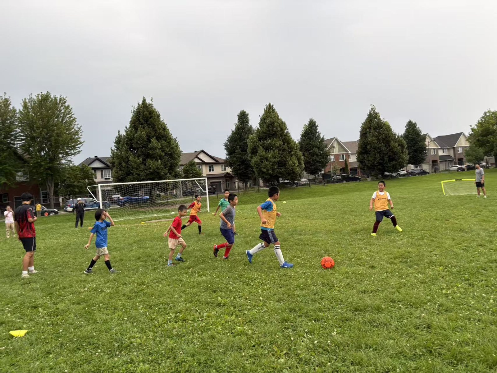 A young player dribbling forward during the soccer match
