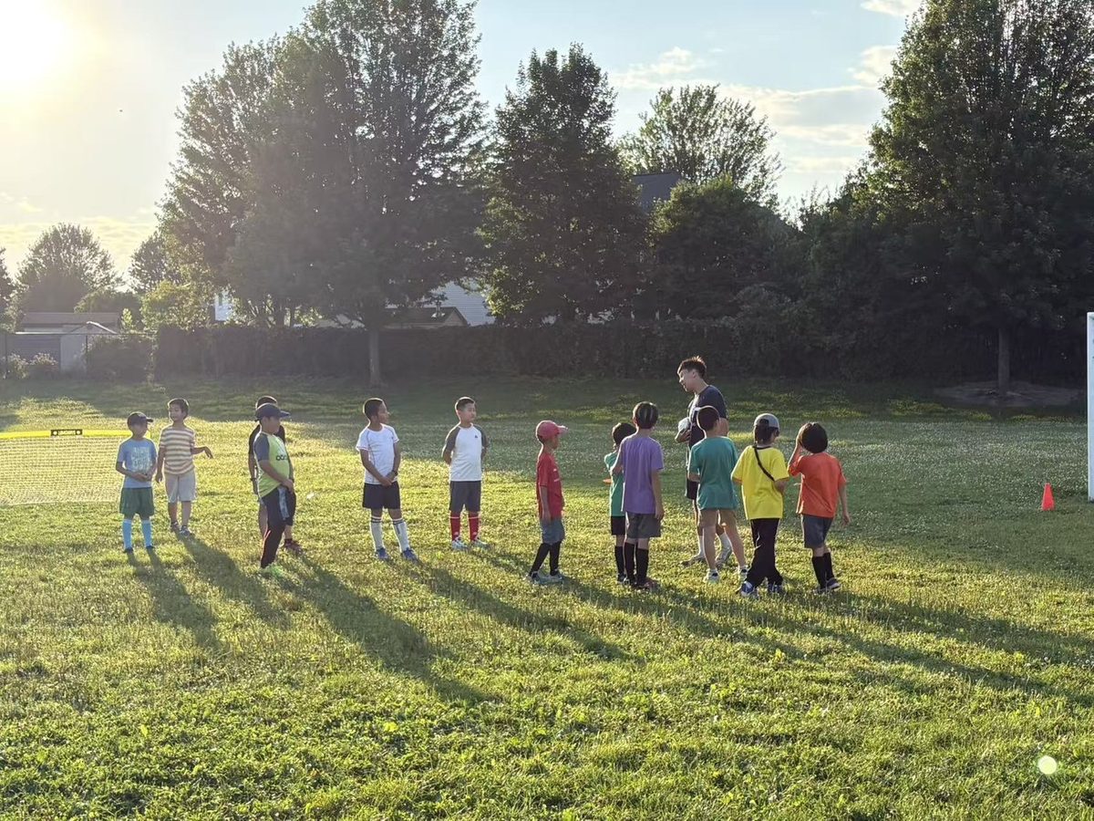 Children enjoying soccer training in the sunshine